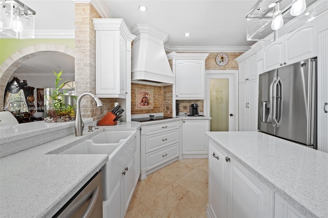15870 NW 10th St, Pembroke Pines, FL 33028 - kitchen featuring stainless steel appliances, crown molding, custom range hood, white cabinetry, and recessed lighting