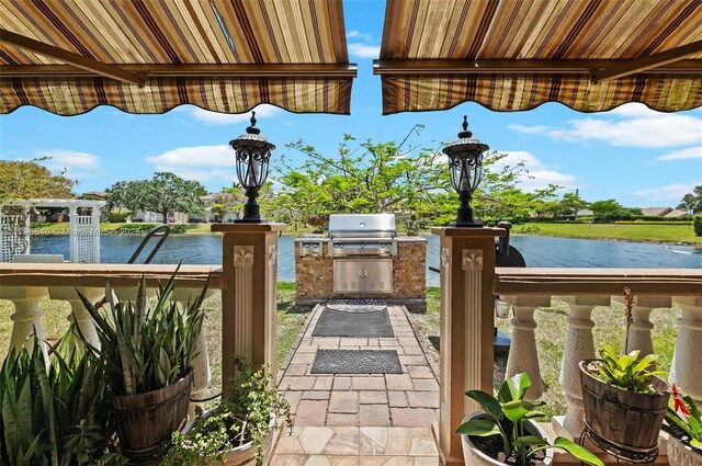 15870 NW 10th St, Pembroke Pines, FL 33028 - view of patio / terrace with a water view, grilling area, and exterior kitchen