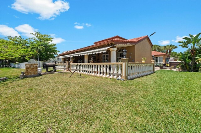 15870 NW 10th St, Pembroke Pines, FL 33028 - back of house featuring a tile roof and stucco siding
