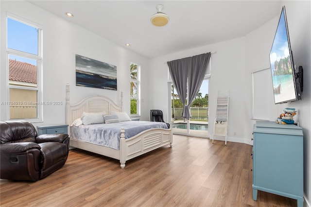 bedroom featuring access to outside, recessed lighting, baseboards, and light wood-type flooring