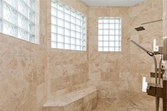 full bath with tiled shower