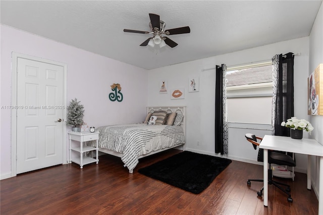 bedroom with baseboards, a ceiling fan, and wood finished floors