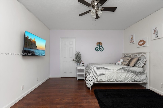 bedroom with baseboards, ceiling fan, and wood finished floors
