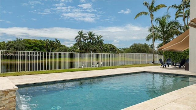 view of pool featuring a fenced in pool, fence, and a patio area