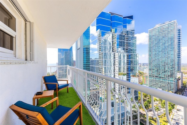 balcony featuring a view of city