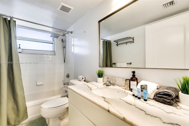 full bath featuring vanity, toilet, visible vents, and shower / tub combo with curtain