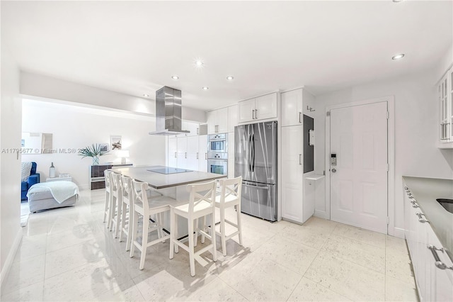 290 Sunrise Dr Unit 3-K, Key Biscayne, FL 33149 - kitchen with stainless steel appliances, ventilation hood, white cabinets, recessed lighting, and baseboards
