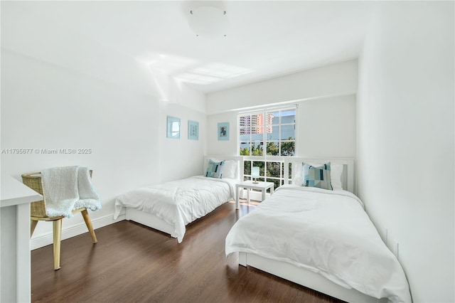 bedroom with wood finished floors