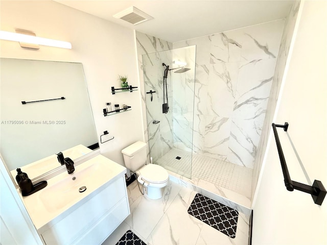 full bathroom featuring vanity, toilet, a marble finish shower, marble finish floor, and visible vents
