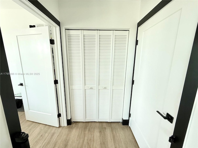 hall with wood finished floors