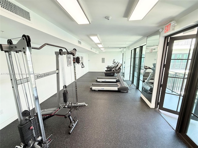 gym featuring visible vents and french doors