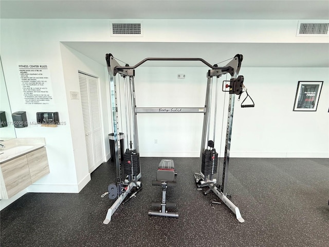 workout area featuring visible vents and baseboards