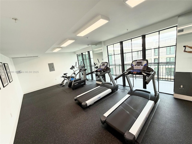 gym with baseboards and visible vents