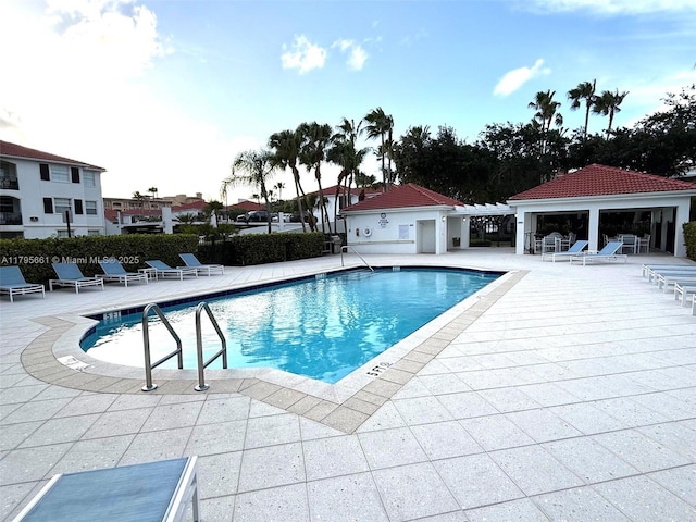 pool featuring a patio area