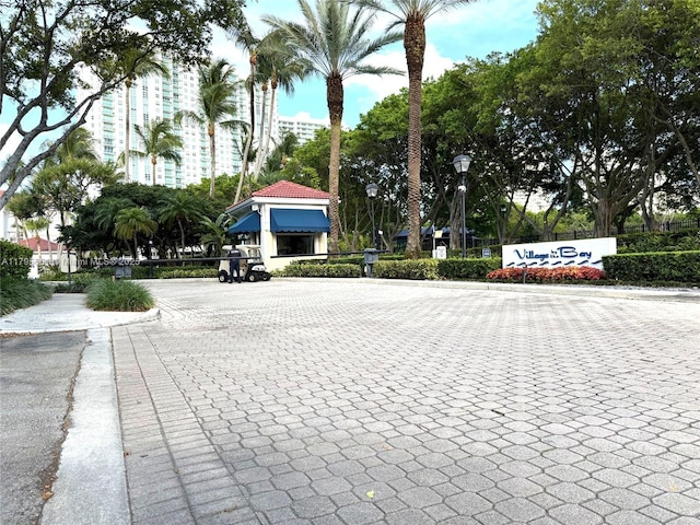 view of street with street lighting and curbs