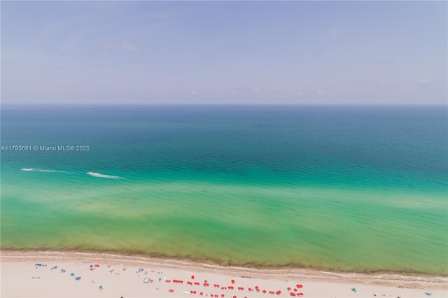 aerial view with a beach view and a water view