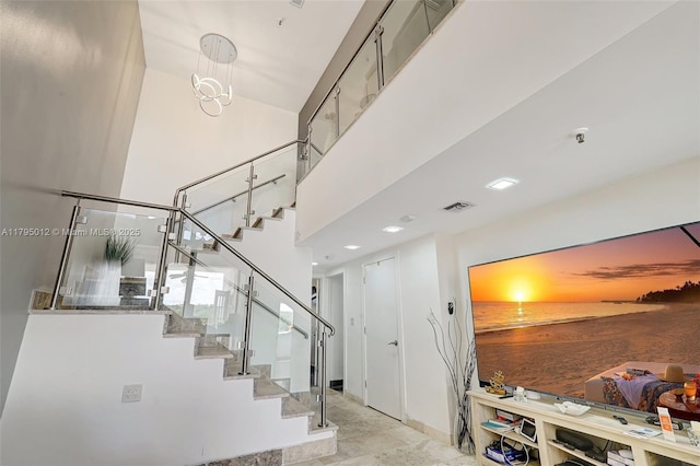 stairway featuring visible vents