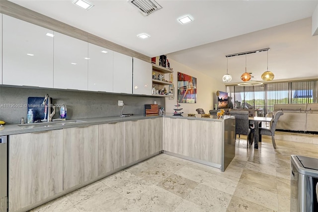 kitchen featuring open shelves, a peninsula, open floor plan, visible vents, and modern cabinets