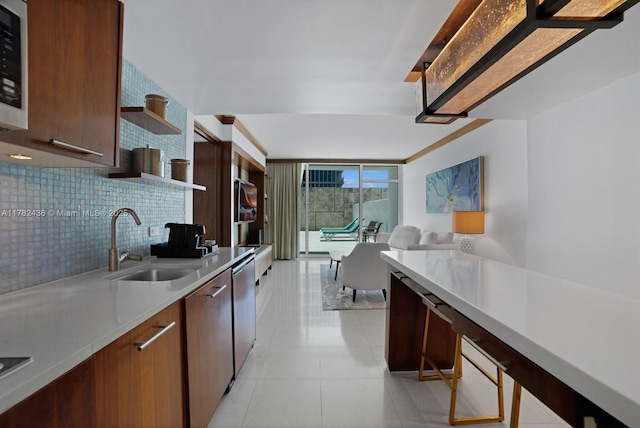 6801 Collins Ave Unit 604, Miami Beach, FL 33141 - kitchen with a sink, open shelves, light countertops, light tile patterned flooring, and dishwasher