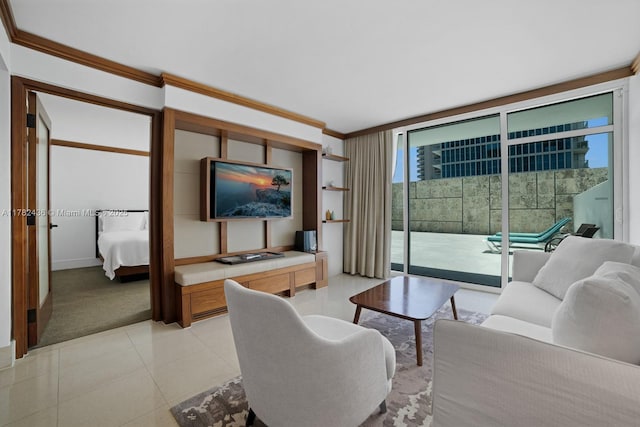 6801 Collins Ave Unit 604, Miami Beach, FL 33141 - living area with crown molding, light tile patterned floors, light colored carpet, a wall of windows, and baseboards
