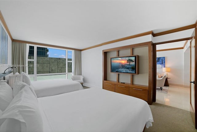 6801 Collins Ave Unit 604, Miami Beach, FL 33141 - carpeted bedroom featuring crown molding, baseboards, and floor to ceiling windows