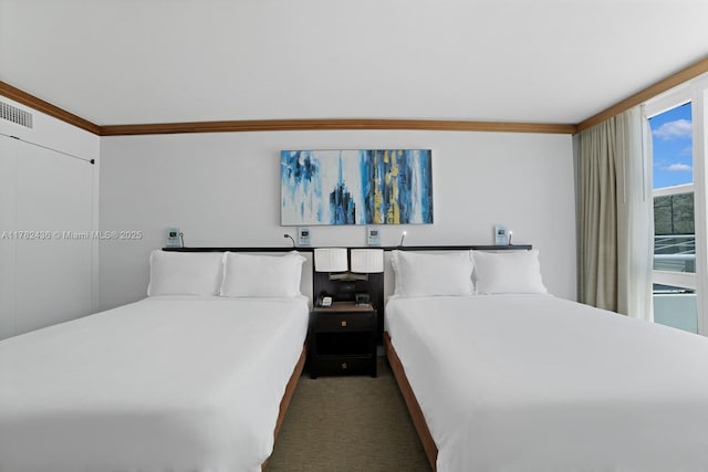 6801 Collins Ave Unit 604, Miami Beach, FL 33141 - bedroom with ornamental molding and carpet