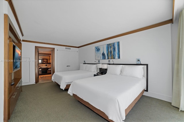 6801 Collins Ave Unit 604, Miami Beach, FL 33141 - bedroom with carpet, ornamental molding, a closet, and baseboards