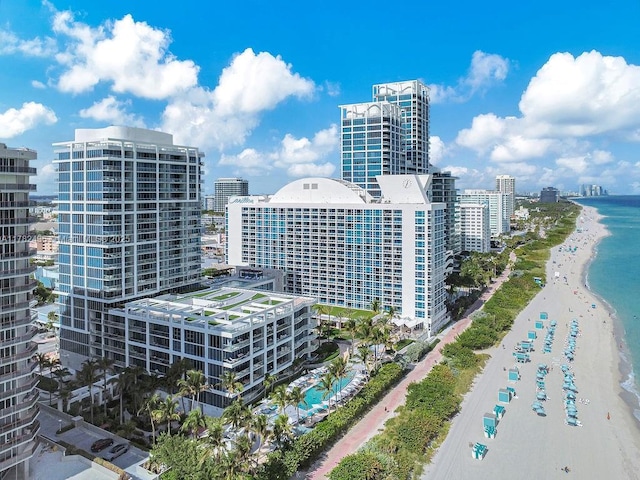 city view featuring a beach view and a water view