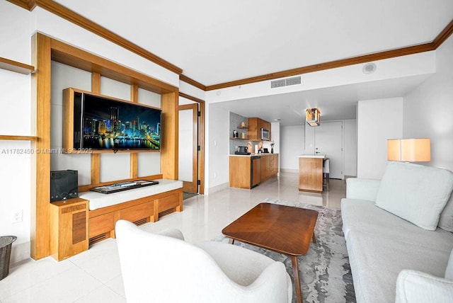 living area featuring baseboards, visible vents, ornamental molding, and light tile patterned floors