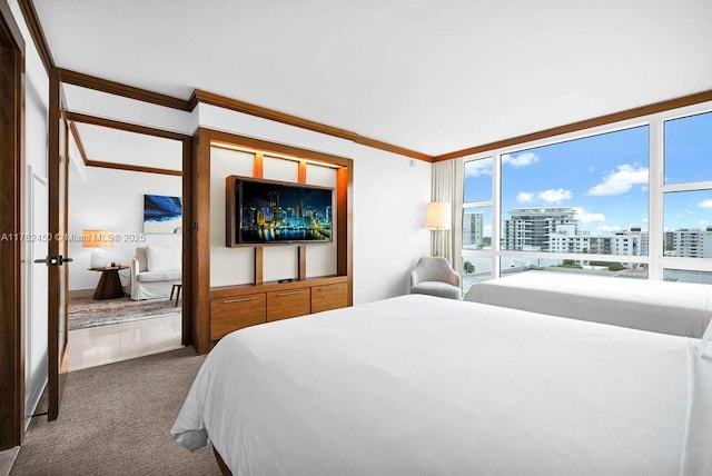 carpeted bedroom featuring ornamental molding