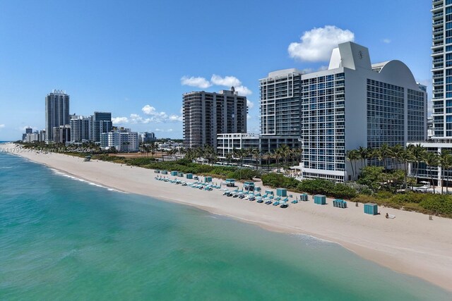 6801 Collins Ave Unit 605, Miami Beach, FL 33141 - aerial view of waterfront with a beach and a view of skyline