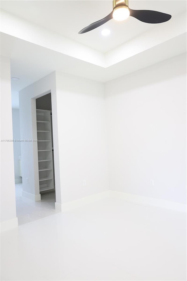 unfurnished room featuring recessed lighting, ceiling fan, and baseboards