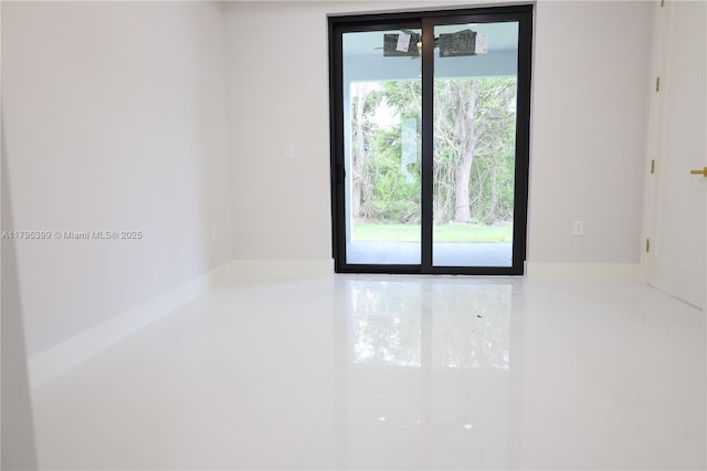 spare room featuring tile patterned flooring