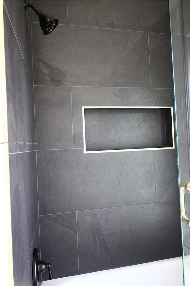 full bath featuring a tile shower
