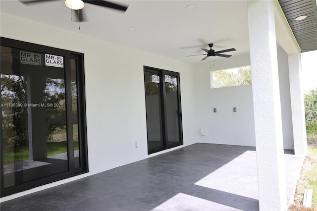 view of patio featuring ceiling fan
