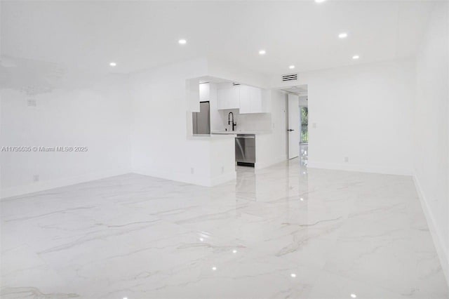 unfurnished living room featuring visible vents, a sink, baseboards, marble finish floor, and recessed lighting