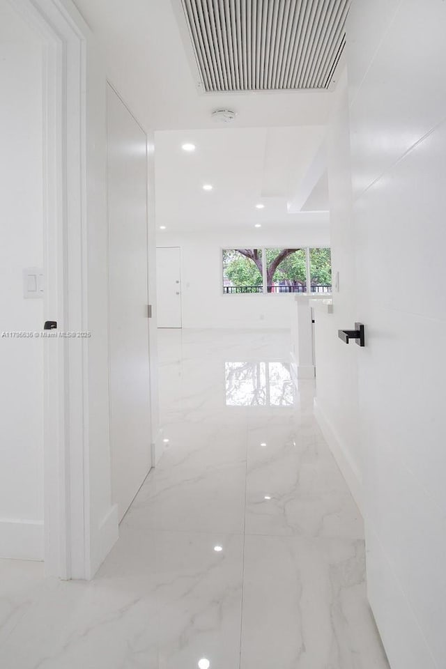 hall featuring visible vents and marble finish floor