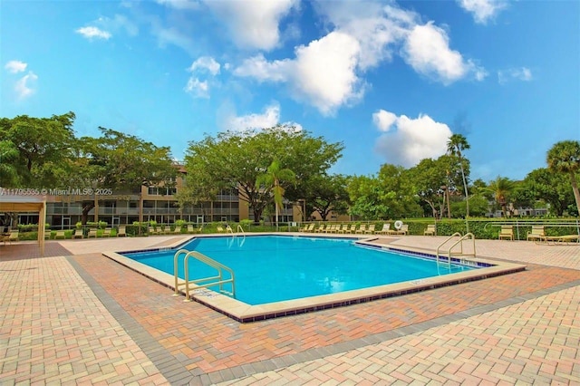 community pool featuring a patio area