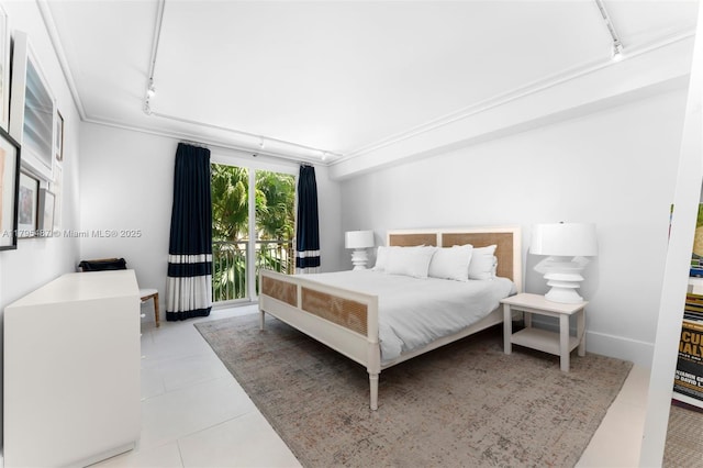 125 Jefferson Ave Unit 113, Miami Beach, FL 33139 - bedroom with track lighting, ornamental molding, tile patterned floors, and access to outside