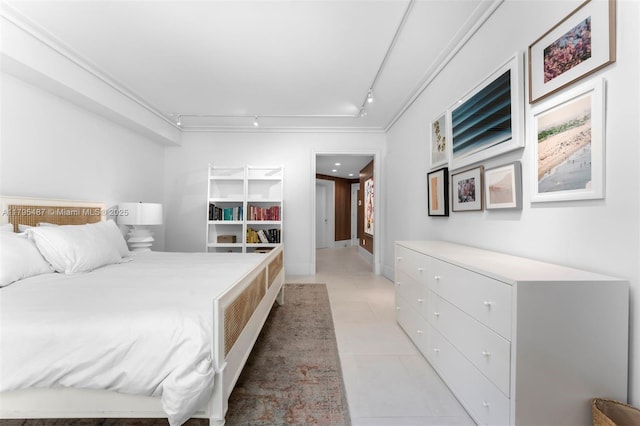 125 Jefferson Ave Unit 113, Miami Beach, FL 33139 - bedroom featuring light tile patterned flooring, rail lighting, and ornamental molding