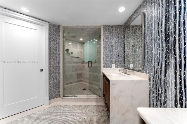 125 Jefferson Ave Unit 113, Miami Beach, FL 33139 - bathroom featuring vanity, tile patterned floors, a stall shower, and recessed lighting