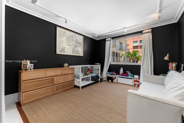 125 Jefferson Ave Unit 113, Miami Beach, FL 33139 - bedroom with track lighting, ornamental molding, and light carpet