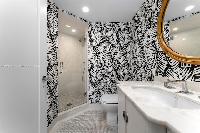 125 Jefferson Ave Unit 113, Miami Beach, FL 33139 - bathroom featuring vanity, toilet, wallpapered walls, recessed lighting, and a stall shower