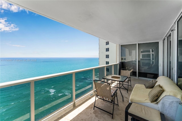 balcony featuring a water view