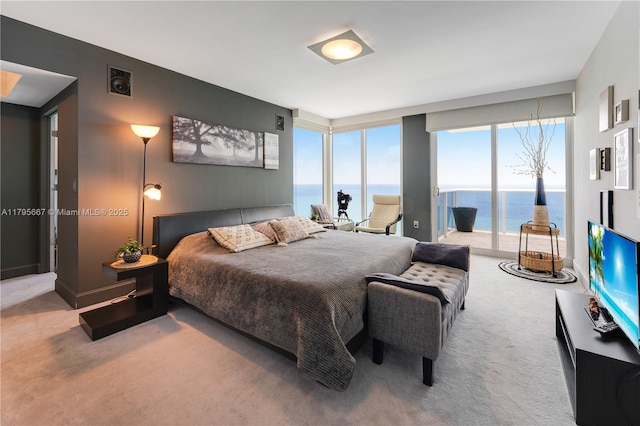 bedroom featuring access to outside, carpet, and visible vents