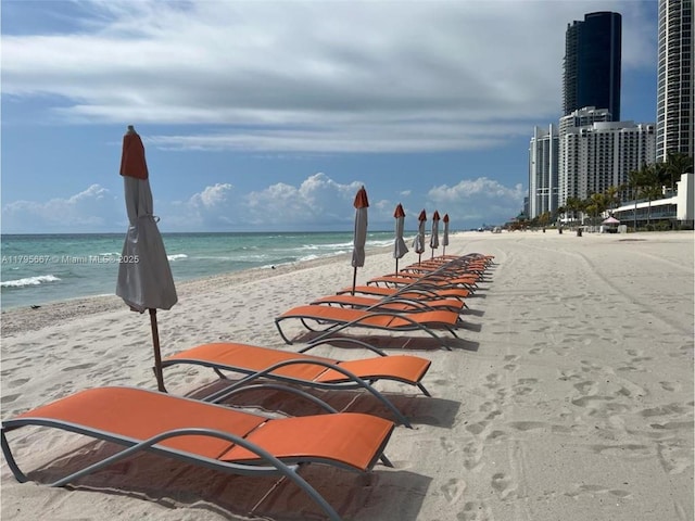 view of water feature with a beach view