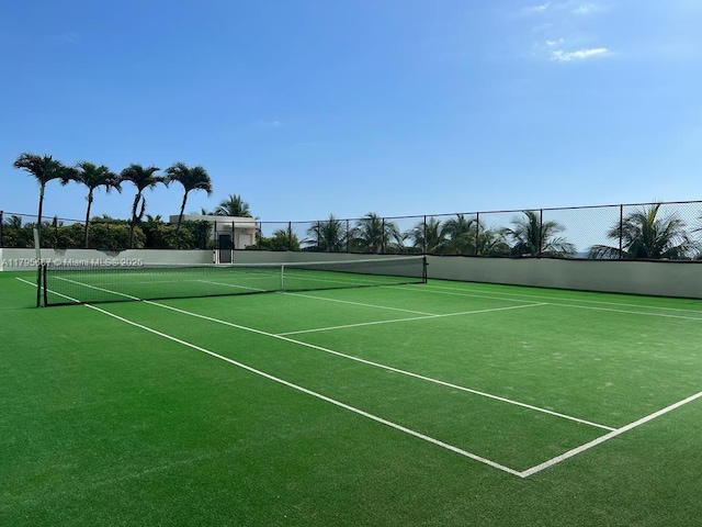 view of sport court with fence