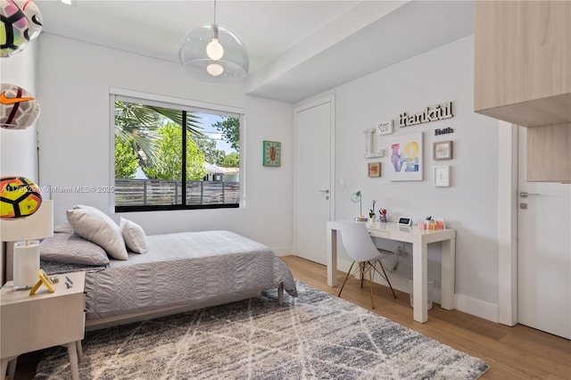 bedroom featuring light wood-style floors