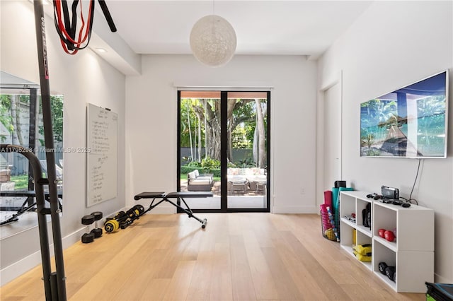workout area with wood finished floors