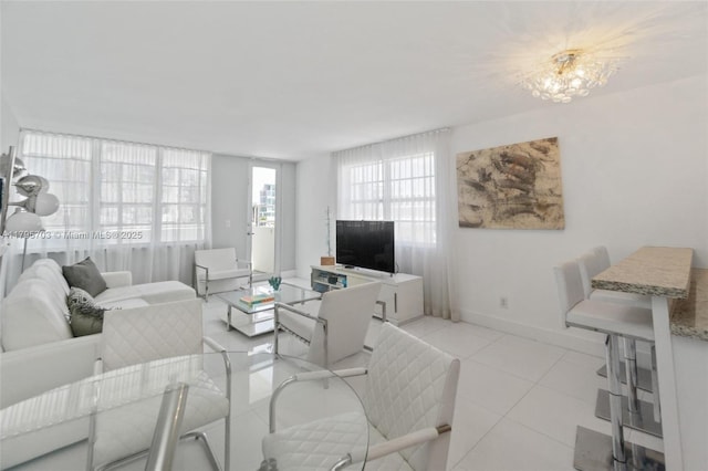 100 Lincoln Rd Unit 611, Miami Beach, FL 33139 - living room featuring light tile patterned floors and baseboards